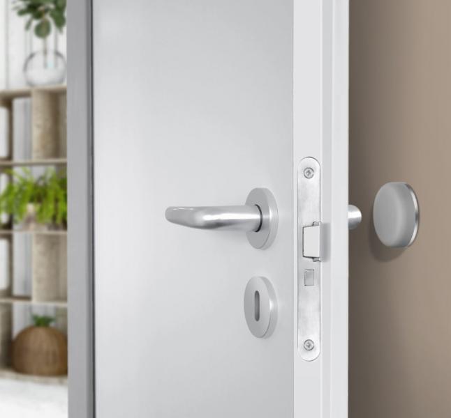 Beslagsboden selvkl&aelig;bende d&oslash;rstopper til v&aelig;g - Gr&aring;